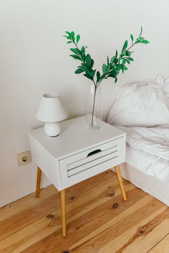 White Table Lamp on Top of Nightstand